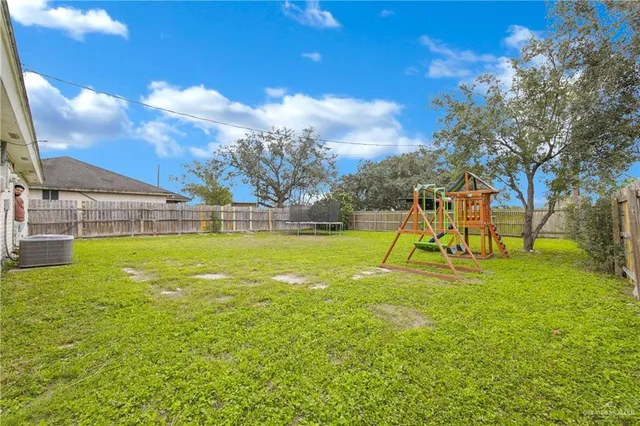 a view of a playground with basketball court