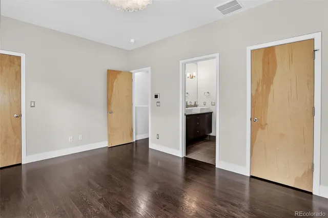 an empty room with wooden floor