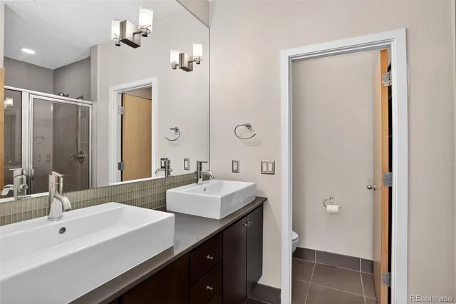 a bathroom with a glass shower door