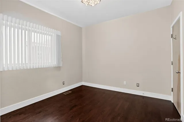 a view of a street with a tree