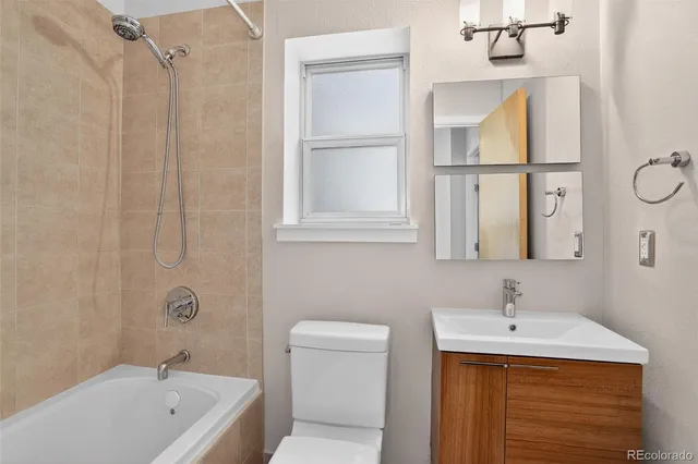a view of a hallway with washer and dryer