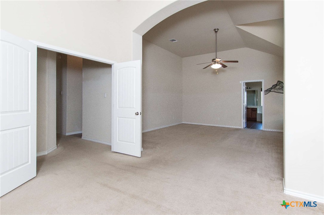 3302 Vineyard Trail Harker Heights, TX 76548 - Photo 13 of 29 an empty room with a ceiling fan and a window