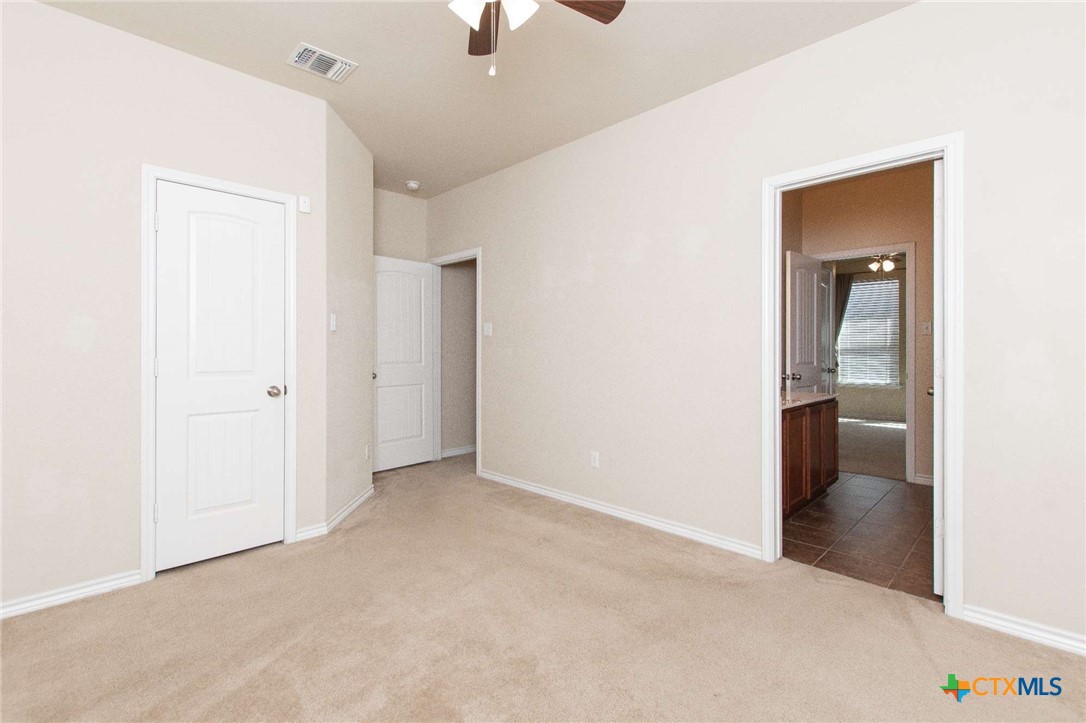 3302 Vineyard Trail Harker Heights, TX 76548 - Photo 20 of 29 an empty room with fan and entrance