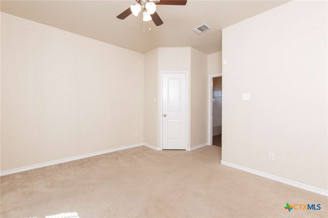 3302 Vineyard Trail Harker Heights, TX 76548 - Photo 25 of 29 an empty room with a chandelier fan