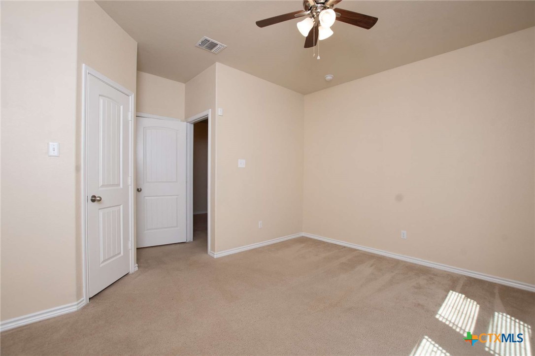 3302 Vineyard Trail Harker Heights, TX 76548 - Photo 27 of 29 an empty room with a chandelier fan