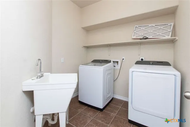 a utility room with dryer and washer