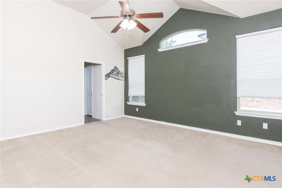 3302 Vineyard Trail Harker Heights, TX 76548 - Photo 10 of 29 a view of a big room with windows and chandelier fan