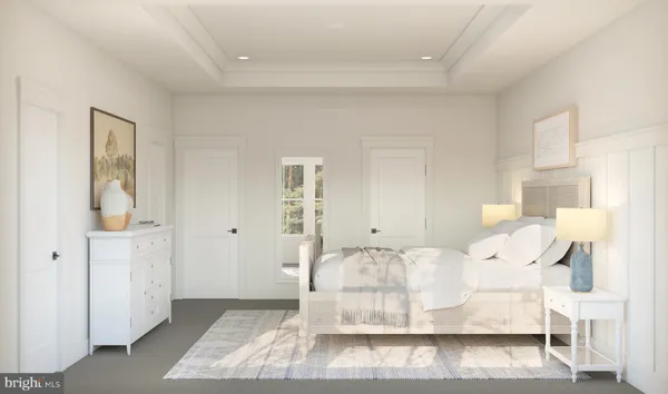 a large white bed in a white room