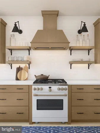 a stove top oven sitting inside of a kitchen