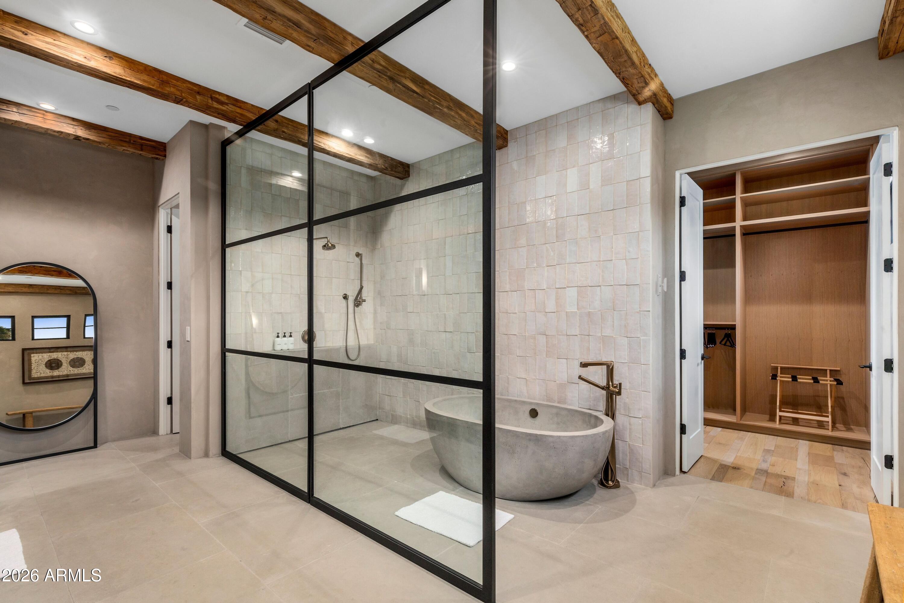 8307 East Gary Road Scottsdale, AZ 85260 - Photo 14 of 34 a spacious bathroom with a tub and shower
