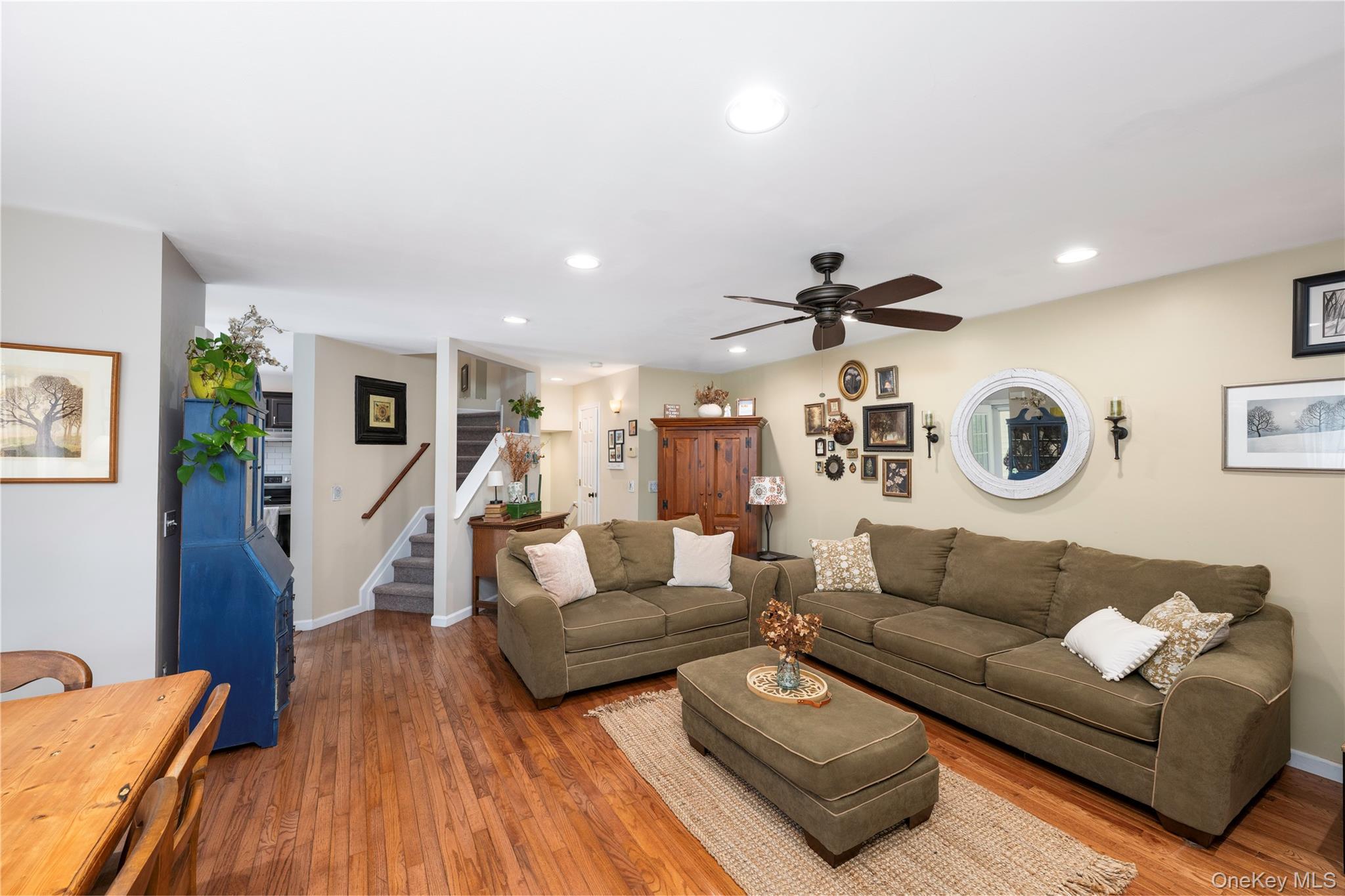 129 Stringham Road, Unit 31 LaGrangeville, NY 12540 - Photo 6 of 26 a living room with furniture and a wooden floor