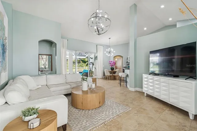 a kitchen with stainless steel appliances granite countertop a refrigerator stove and sink