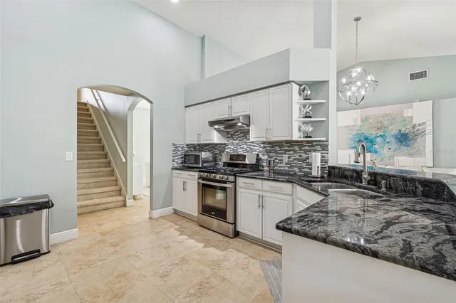 a bathroom with a shower curtain and a window