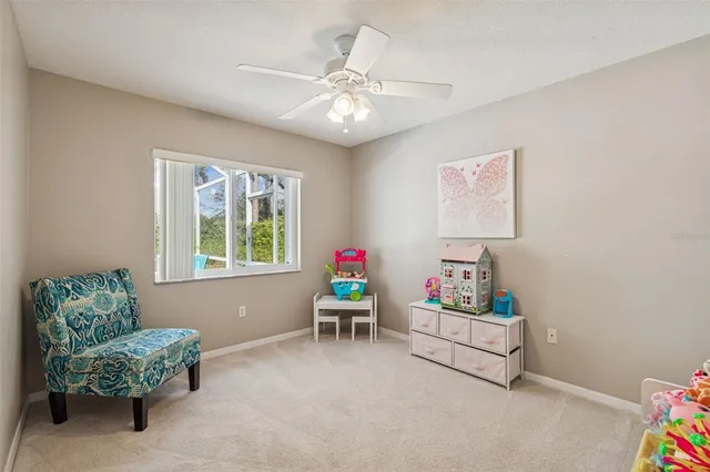 a view of a backyard house with swimming pool and furniture