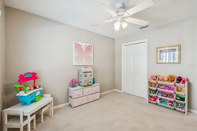 a view of a chairs and table in the roof deck