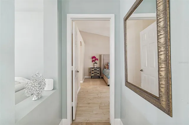 an aerial view of a house with a yard and large trees