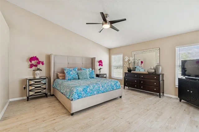 an aerial view of residential building with outdoor space and lake view