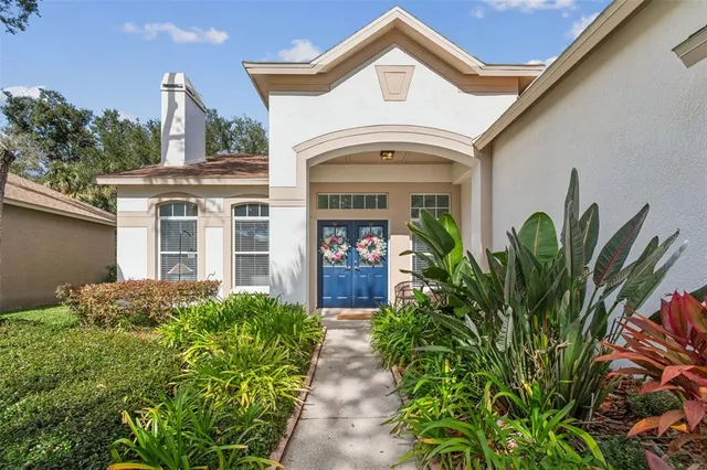 a flower room with wooden floor and a bookshelf