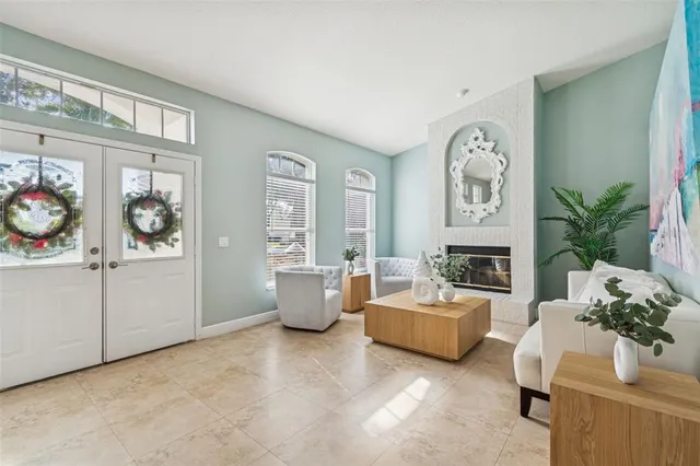 a living room with furniture and a large window