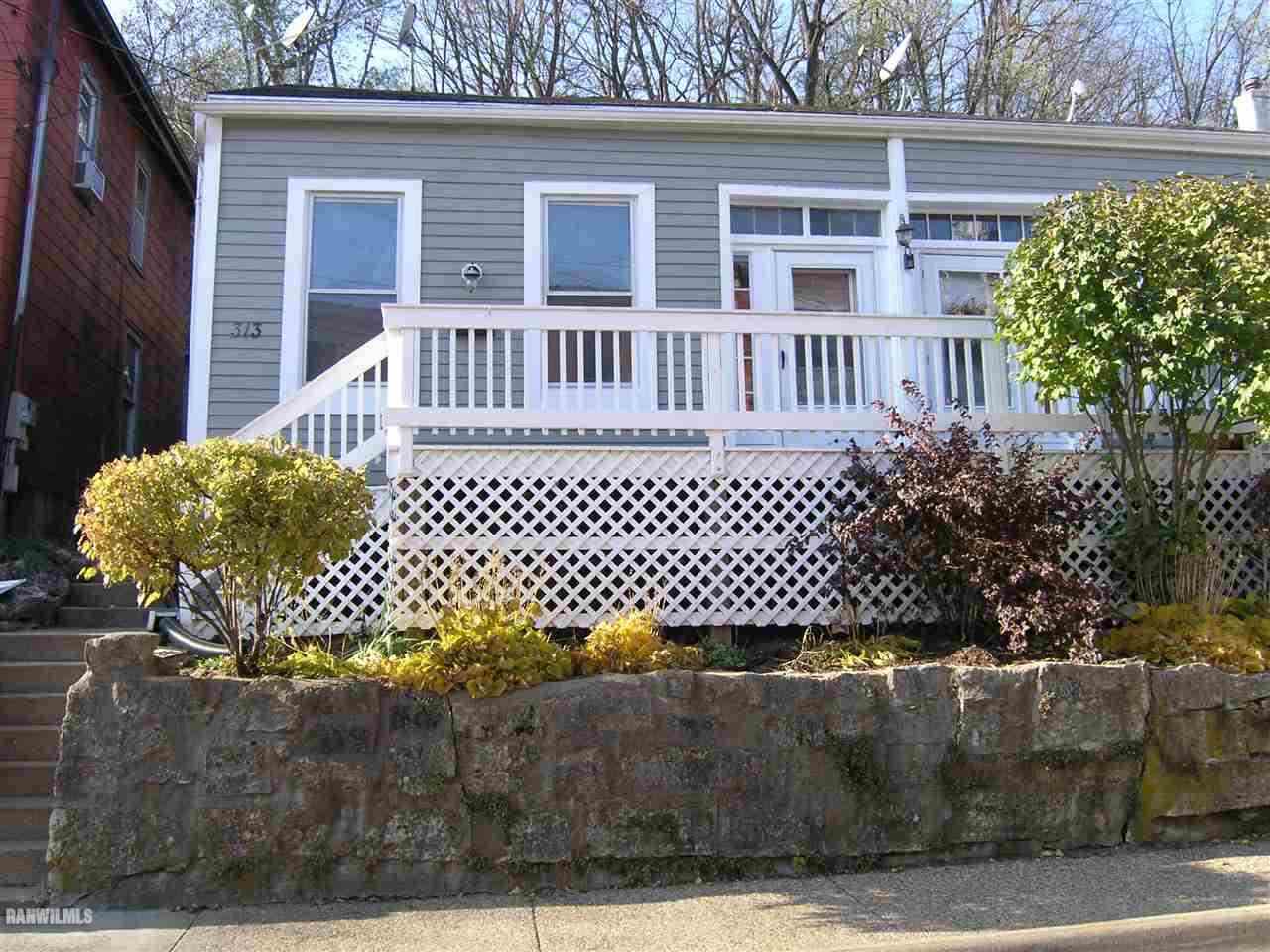 313 South Bench Street Galena, IL 61036 - Photo 1 of 19 a wooden fence with a bench
