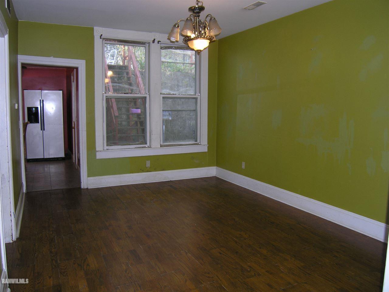 313 South Bench Street Galena, IL 61036 - Photo 11 of 19 a view of a room with wooden floor and windows