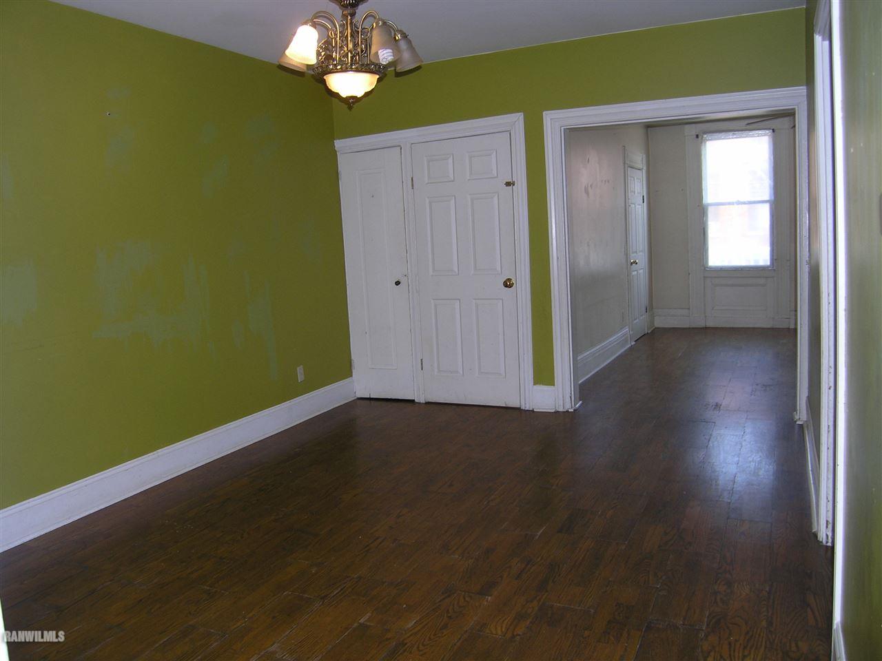 313 South Bench Street Galena, IL 61036 - Photo 12 of 19 a view of an empty room with window and wooden floor