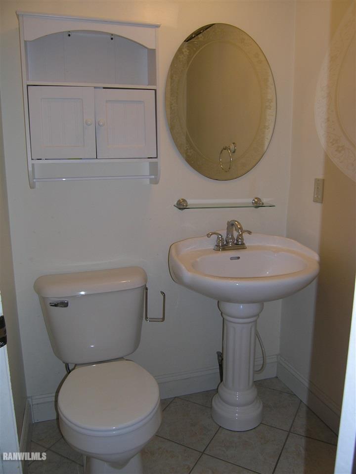 313 South Bench Street Galena, IL 61036 - Photo 14 of 19 a bathroom with a toilet and a sink