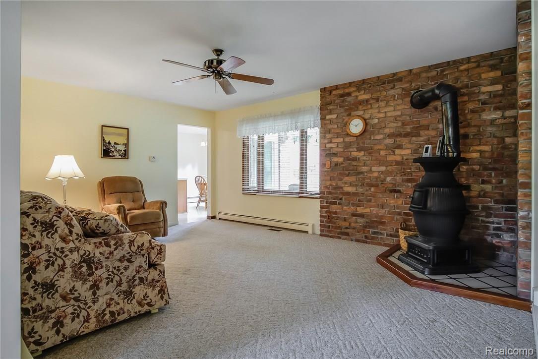 25464 Johns Road South Lyon, MI 48178 - Photo 11 of 23 Family Room with wood burning stove