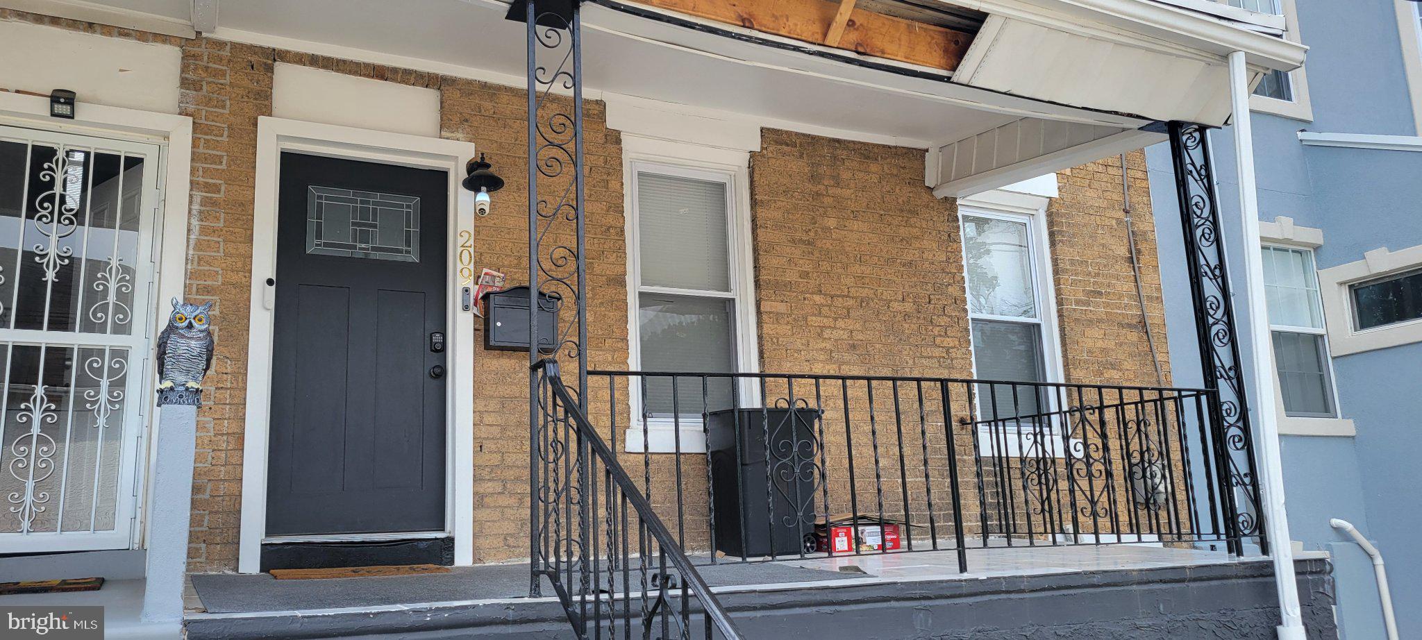 209 North 10th Street Darby, PA 19023 - Photo 1 of 26 Charming brick facade with welcoming porch.