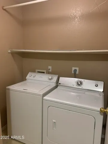a bathroom with a sink double vanity granite tub shower and a mirror