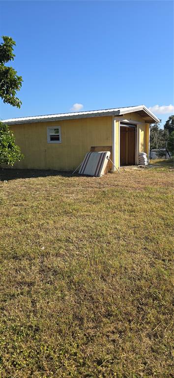315 Virginia Street Frostproof, FL 33843 - Photo 20 of 23 a view of outdoor space and yard