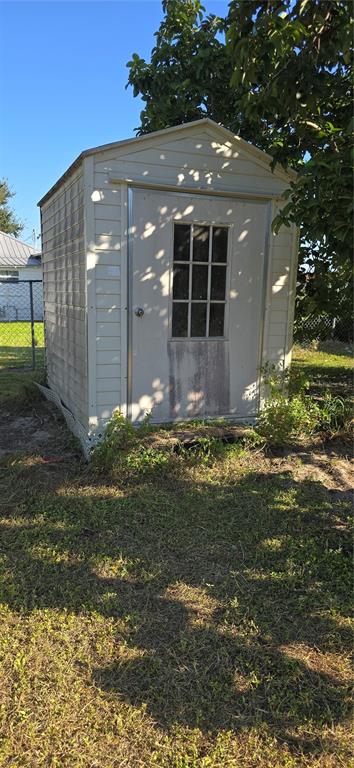 315 Virginia Street Frostproof, FL 33843 - Photo 21 of 23 a view of a backyard
