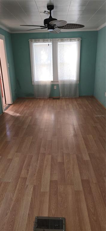 315 Virginia Street Frostproof, FL 33843 - Photo 4 of 23 a view of empty room with window