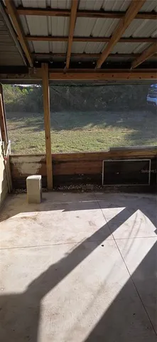 a view of room with wooden floor