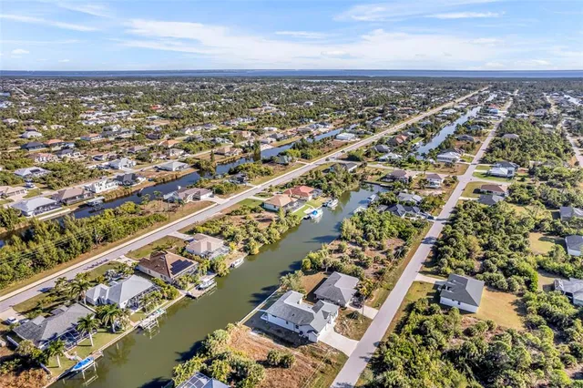 an aerial view of a city with ocean view