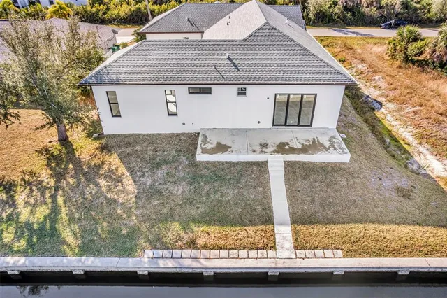 front view of house with large windows and outdoor space