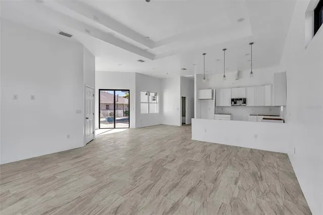 a view of a kitchen with wooden floor