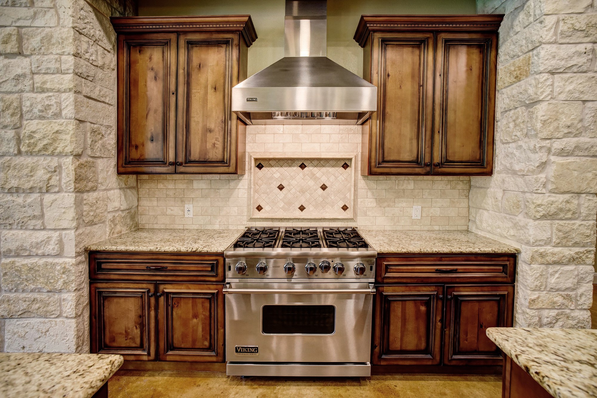 115 Pine Point Cove Elgin, TX 78621 - Photo 12 of 39 Culinary delights await in this chef's kitchen featuring a professional-grade range and granite countertops.