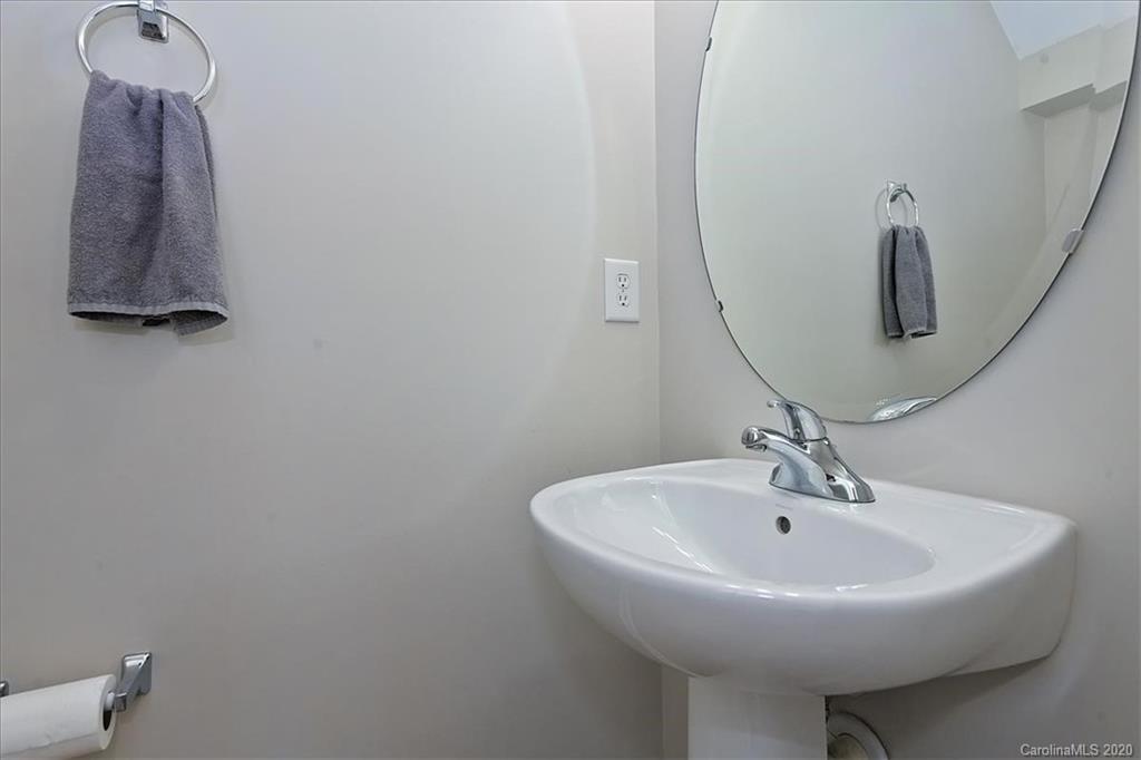 231 Primrose Walk Fort Mill, SC 29715 - Photo 24 of 34 a bathroom with a sink and mirror