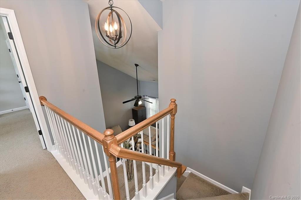 231 Primrose Walk Fort Mill, SC 29715 - Photo 26 of 34 a view of staircase with wooden floor