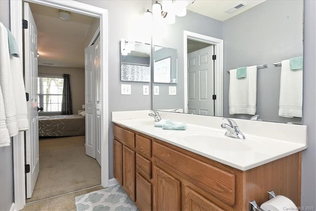 231 Primrose Walk Fort Mill, SC 29715 - Photo 10 of 34 a en suite bathroom with a sink and a mirror