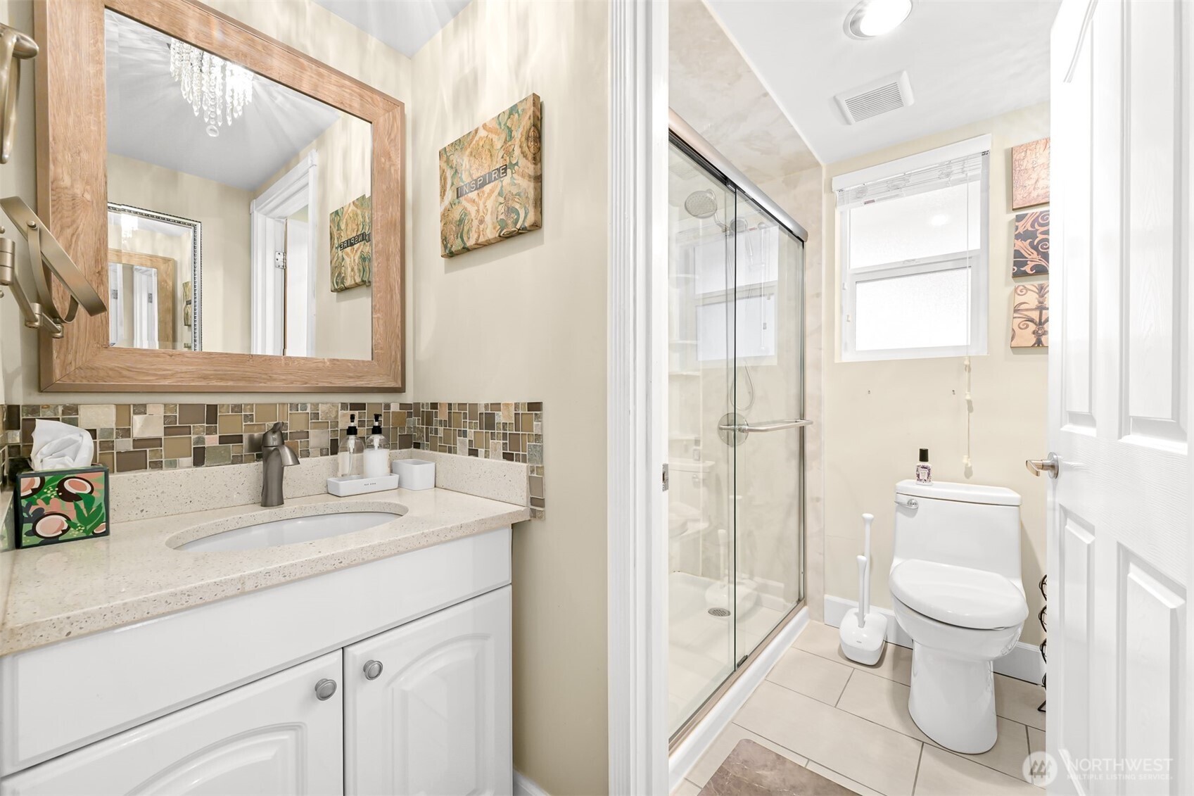 8192 Sehome Road Blaine, WA 98230 - Photo 18 of 40 a bathroom with a sink a toilet and shower