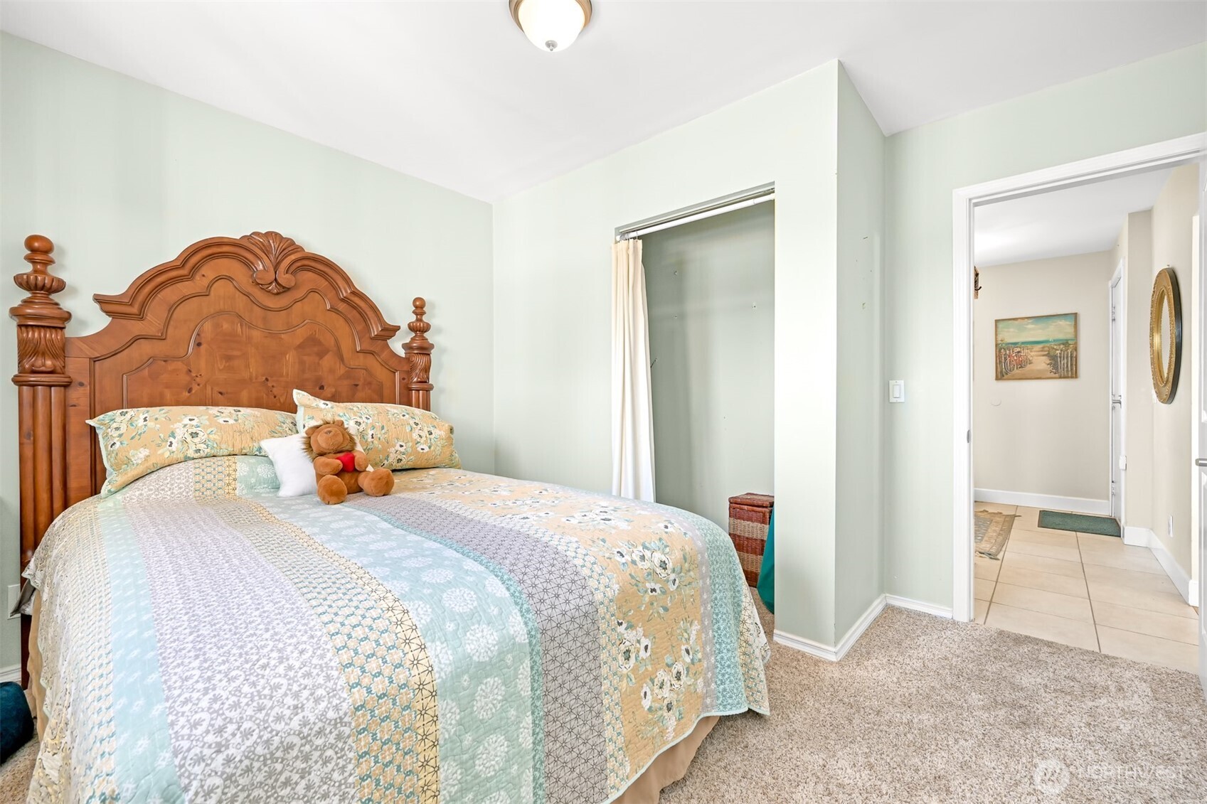 8192 Sehome Road Blaine, WA 98230 - Photo 25 of 40 a bedroom with a bed and a mirror