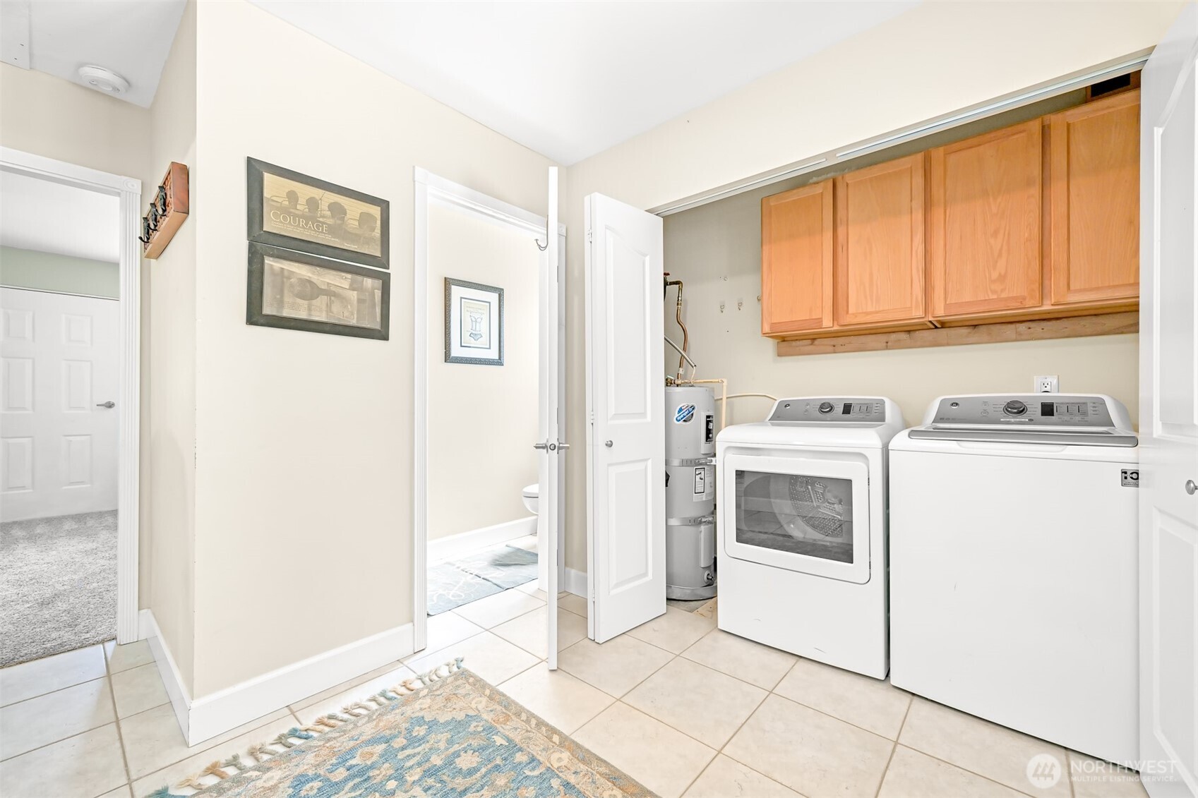 8192 Sehome Road Blaine, WA 98230 - Photo 26 of 40 a kitchen with a stove top oven and cabinets