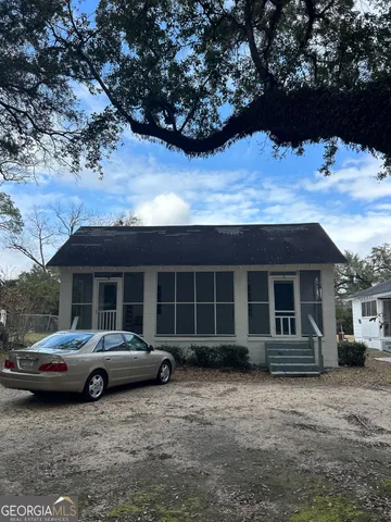 a view of a car parked in front of house