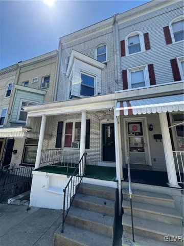 a view of a building with a street