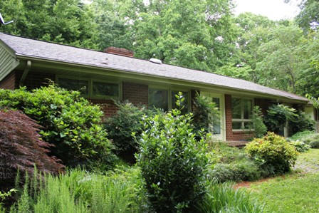 1731 Rutrough Road Southeast Roanoke, VA 24014 - Photo 2 of 34 a view of a house with potted plants and a table and chair