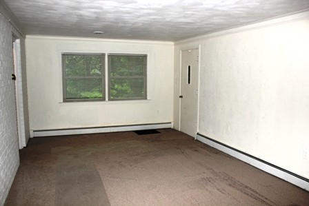 1731 Rutrough Road Southeast Roanoke, VA 24014 - Photo 12 of 34 an empty room with a window