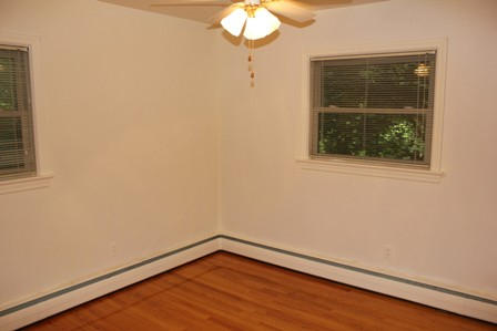 1731 Rutrough Road Southeast Roanoke, VA 24014 - Photo 17 of 34 a view of a room with wooden floor and a window
