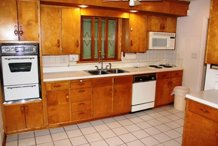 1731 Rutrough Road Southeast Roanoke, VA 24014 - Photo 5 of 34 a kitchen with stainless steel appliances a sink stove and cabinets